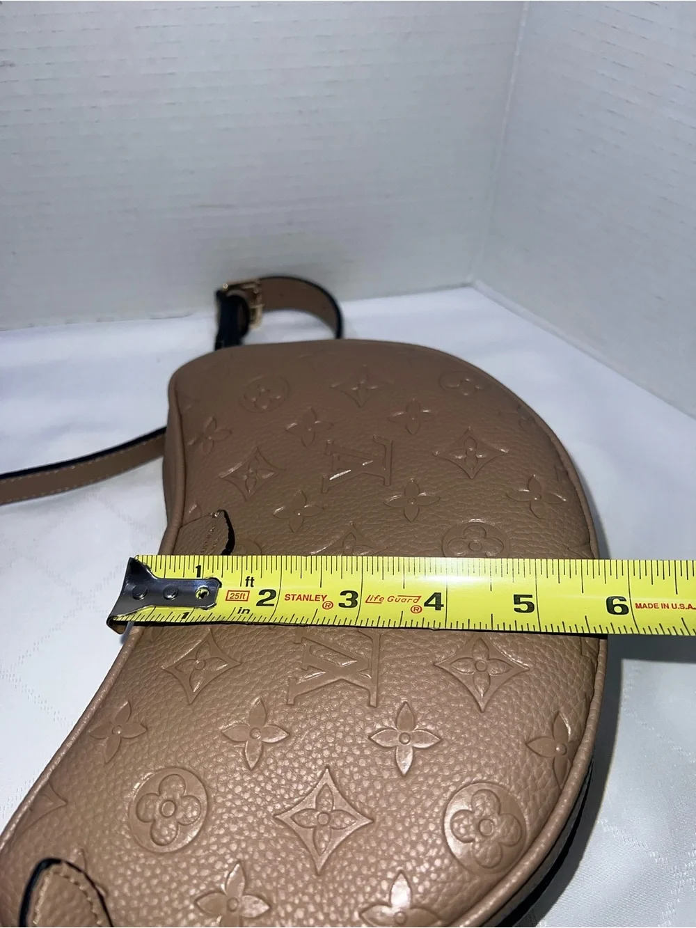 Designer inspired half-moon shoulder bag in a neutral taupe leather w/monogram